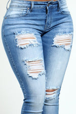 Mid Rise Distressed Jeans