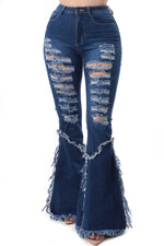 Jeans desgastados de pierna ancha y cintura alta