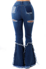 Jeans desgastados de pierna ancha y cintura alta